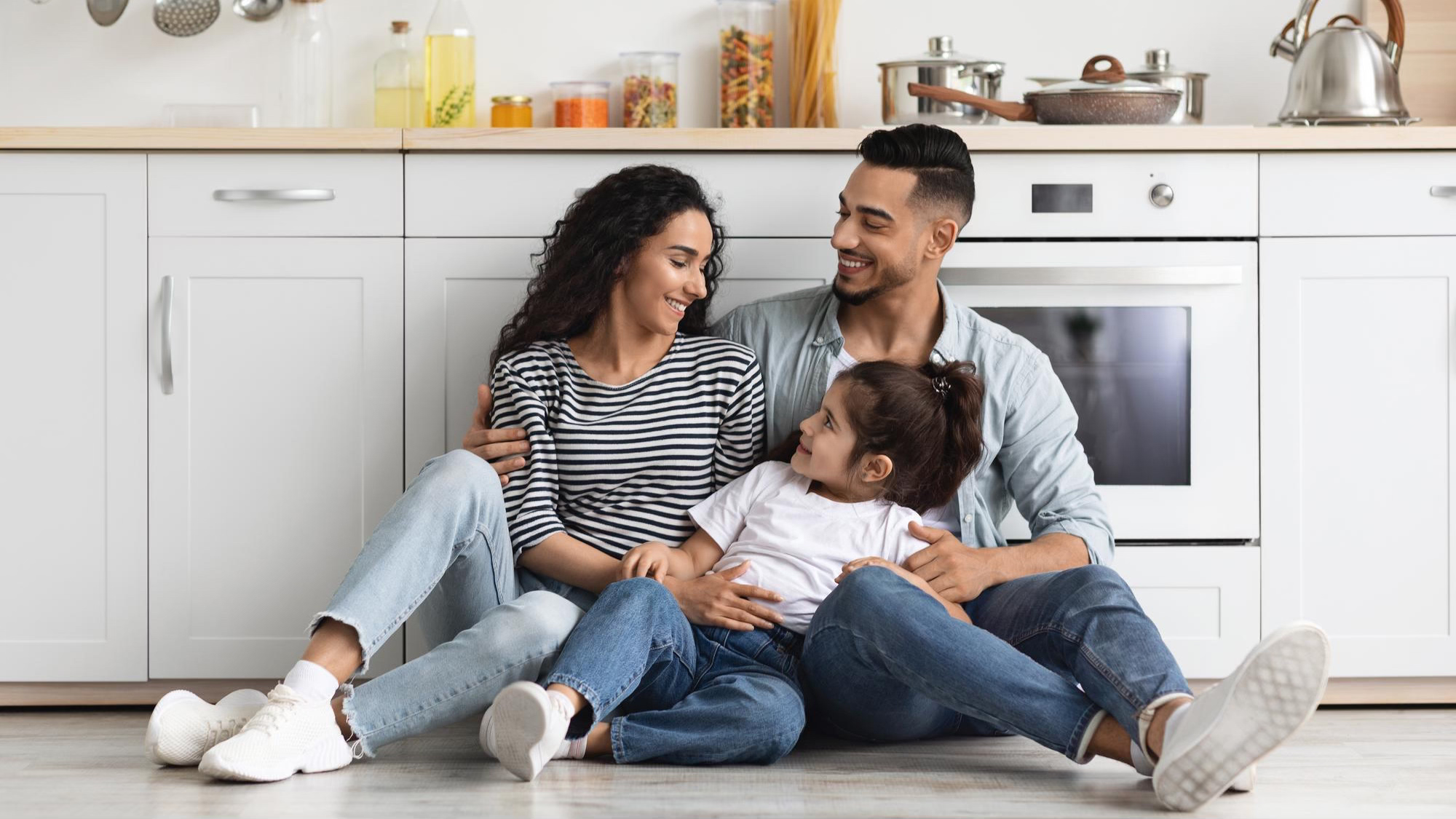 Family sitting in kitchen